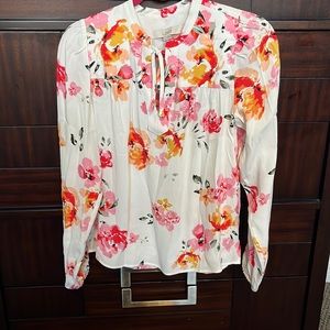 I bought this blouse and never wore it. Beautiful quality and flattering too
